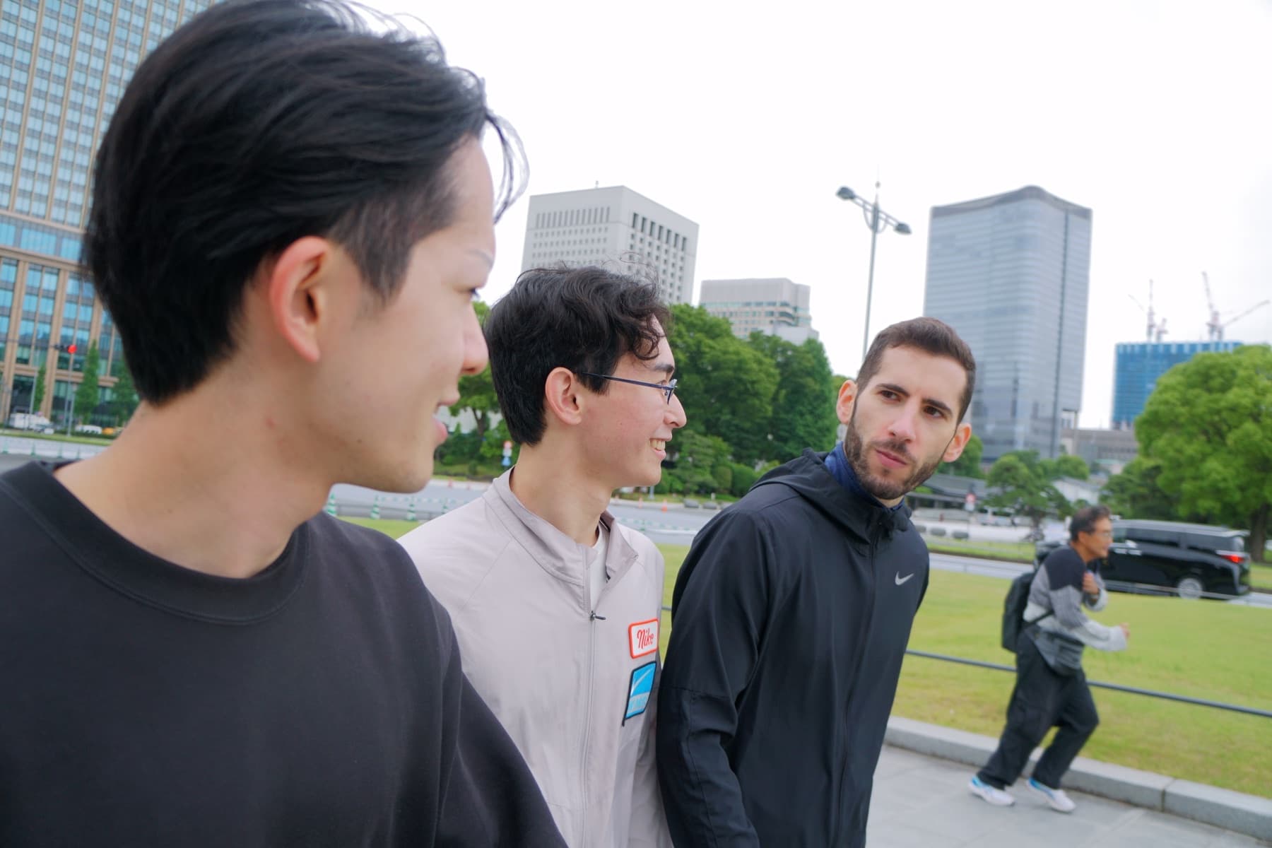 Runners talking in an urban park